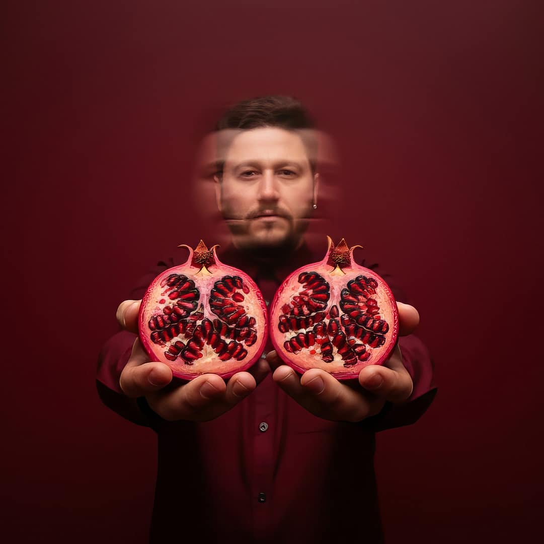 Mahir holding pomegranates